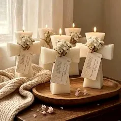 Inspiration: cross shaped candles tied with small flowers and name tags