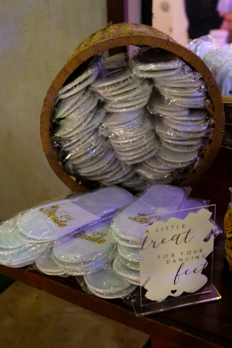 Basket of slipper favours with an A Little Treat for Your Dancing Feet sign